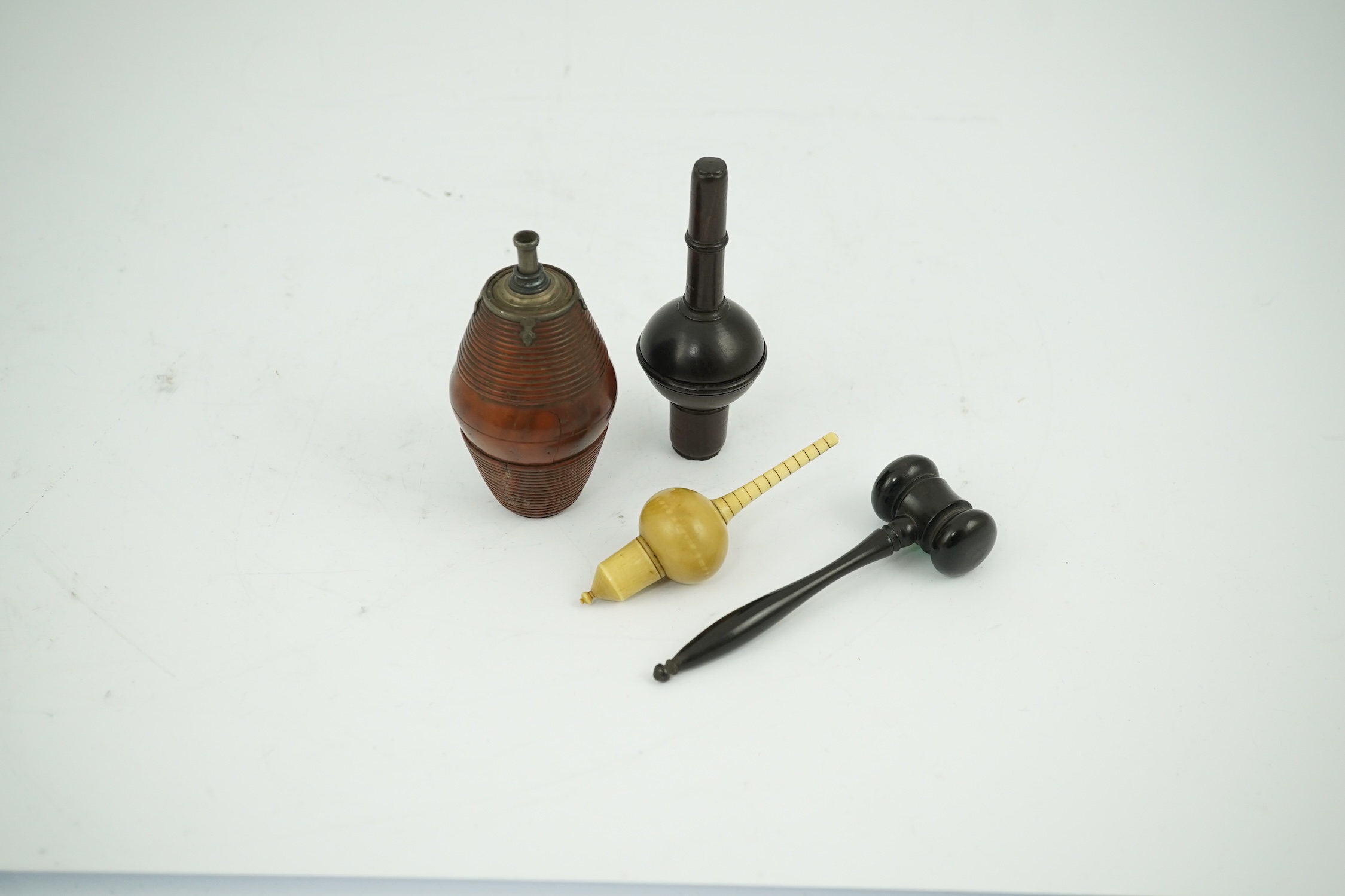 A 19th century coquilla nut powder flask, a hardwood cased ivorine hydrometer and a small ebony gavel, gavel 11cm long. Condition - good